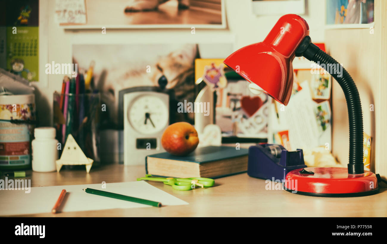 Lamp on schoolboy desk Stock Photo