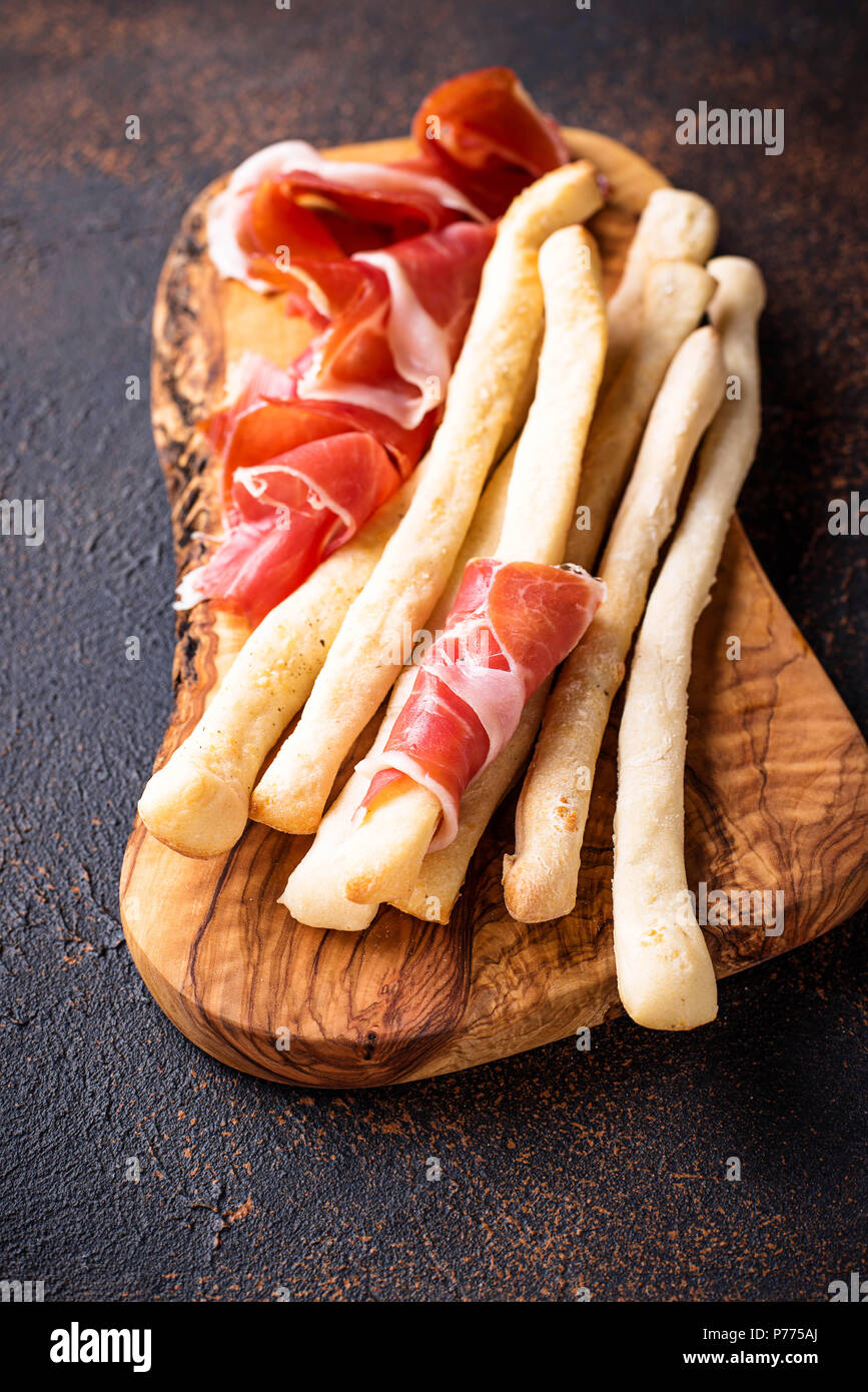 Traditional Italian antipasto grissini and prosciutto Stock Photo Alamy