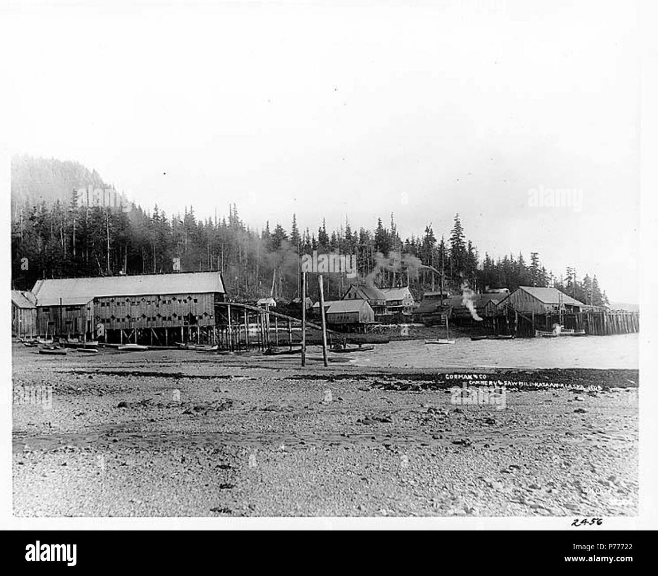 . English: Gorman and Co. cannery and sawmill, Kasaan, 1908 . English: Caption on image: Gorman & Co. Cannery & Saw Mill, Kasaan, Alaska, 1908. W.H. Case Kasaan is located on Kasaan Bay on southwest coast of Kasaan Peninsula, Prince of Wales Island, Alexander Archipelago. The village was established in the 1890s when a salmon-packing plant was located here. Haida Indians from Kasaan, now Old Kasaan, relocated here. The post office, established in 1900, was named for the old village. The population was 47 in 1950. (497) Notes from Donald Orth, Dictionary of Alaska Place Names: Geological Survey Stock Photo