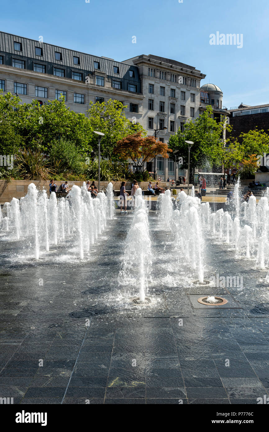 Dozens of water fountains provide entertainment and fun in Piccadilly Gardens, Manchester, UK Stock Photo