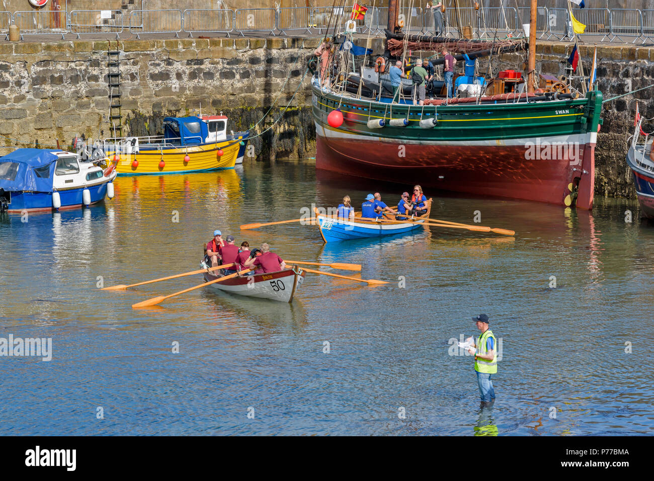 PORTSOY FESTIVAL ABERDEENSHIRE SCOTLAND BOAT RACES HARBOUR SCENE WITH