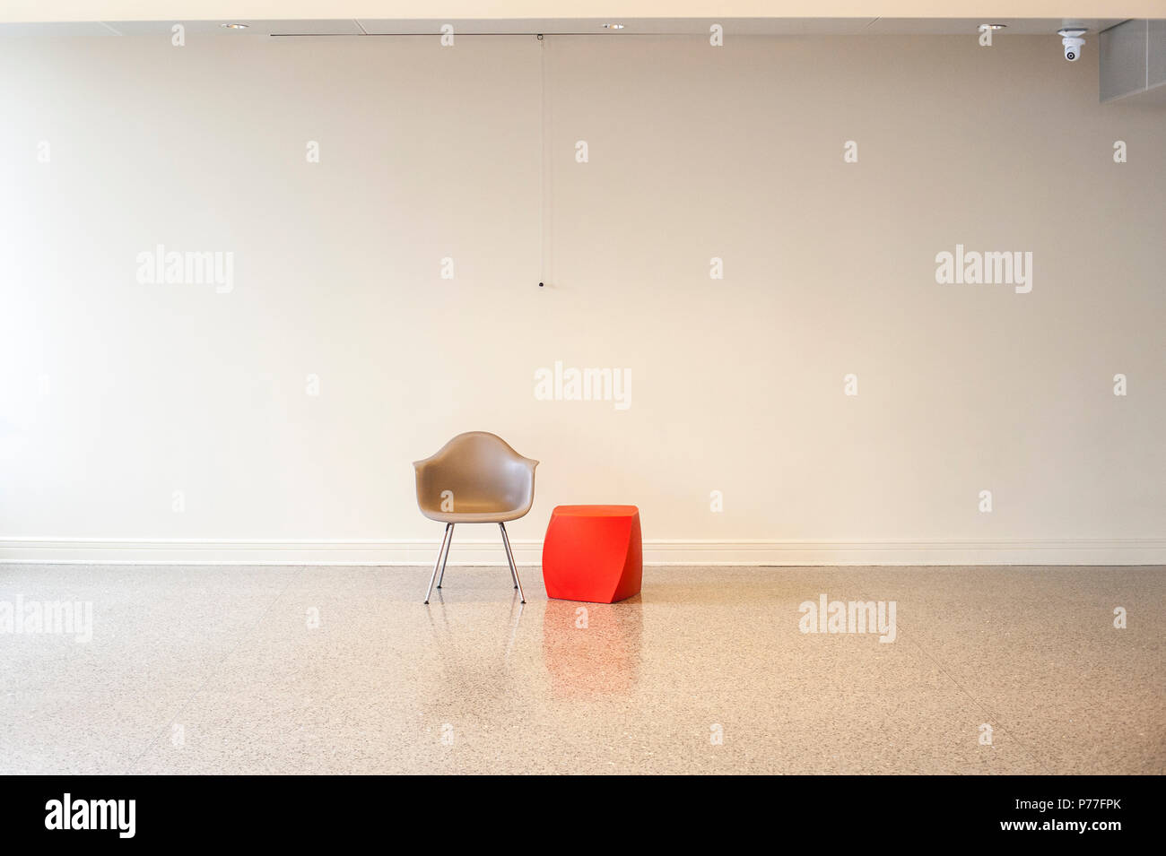 Empty Conference Room With Only A Chair And Red Abstract Side