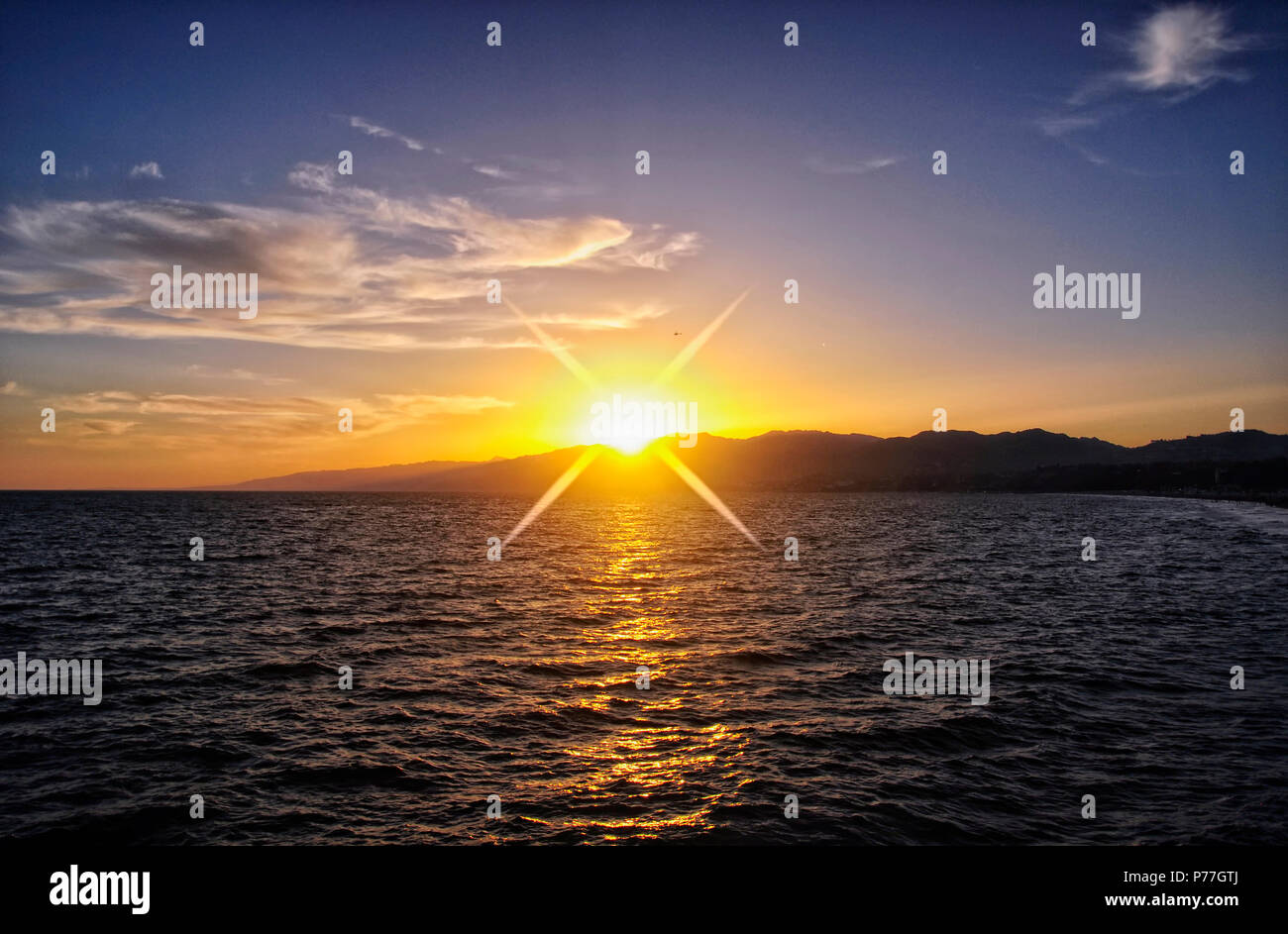 A beautiful sunset over the Pacific Ocean near Santa Monica beach and pier in California. Stock Photo