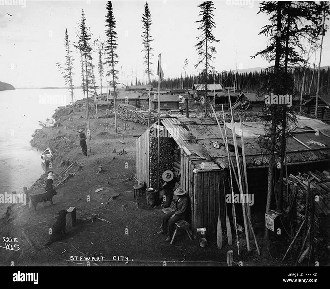 . English: Stewart City on the Stewart River, Yukon Territory, ca. 1898. English: This settlement served as a wood point for steamboats and a stopping point for those headed toward the Klondike. Shows log cabins and wood piles . Caption on image: 'Stewart City' Original photograph by Eric A. Hegg 146; copied by Webster and Stevens 221.A. Subjects (LCTGM): Rivers--Yukon; Log buildings--Yukon--Stewart City; Storage facilities--Yukon--Stewart City; Fuelwood--Yukon--Stewart City Subjects (LCSH): Stewart River (Yukon)  . circa 1898 12 Stewart City on the Stewart River, Yukon Territory, ca 1898 (HEG Stock Photo