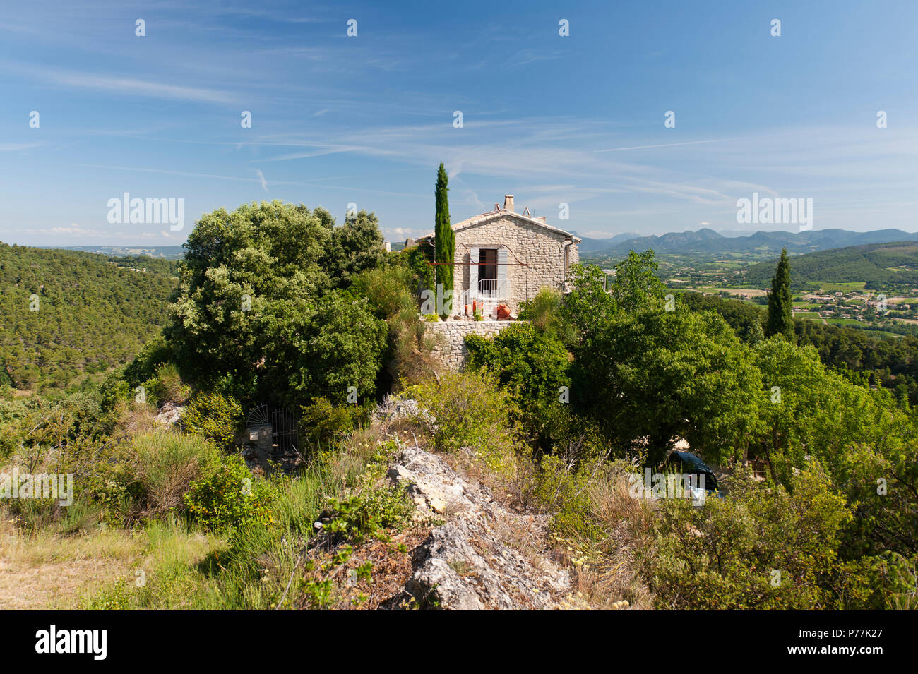Stone house amongst trees Stock Photo