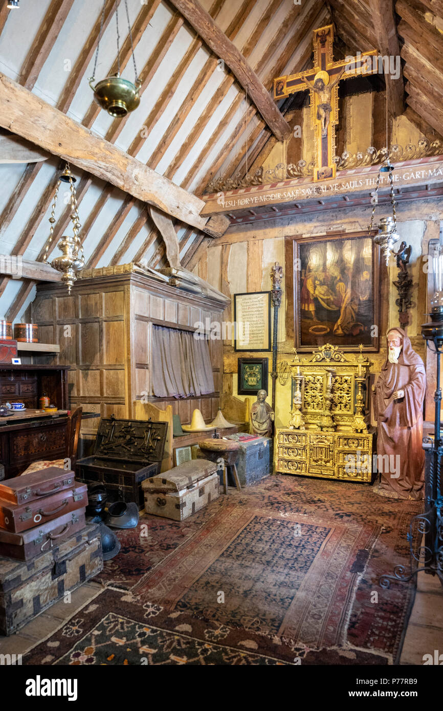Charles Wades bedroom in the Priests House at Snowshill Manor in the Cotswold village of Snowshill, Gloucestershire UK Stock Photo