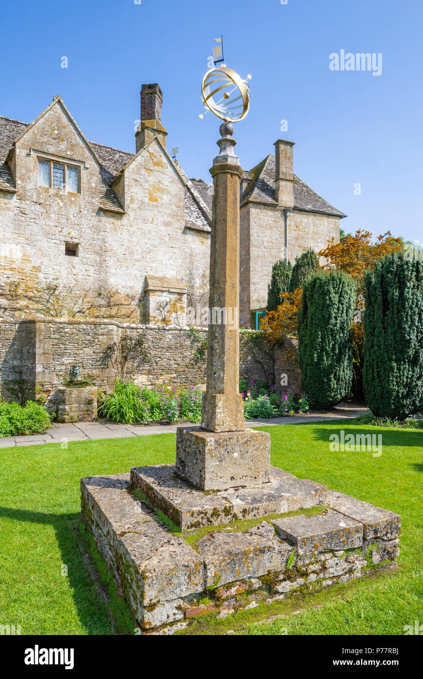 The sundial in Armillary Court at Snowshill Manor in the Cotswold village of Snowshill, Gloucestershire UK Stock Photo
