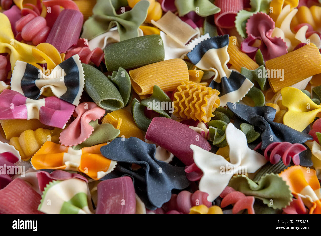 Multicolored pasta of different shapes . Background. Selective focus