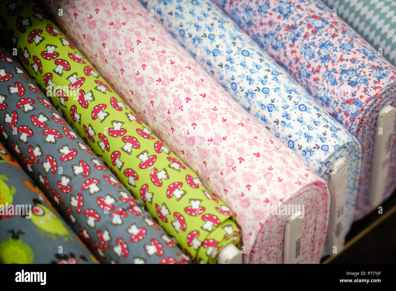 textile fabric rolls with  pattern on market  - Stock Photo