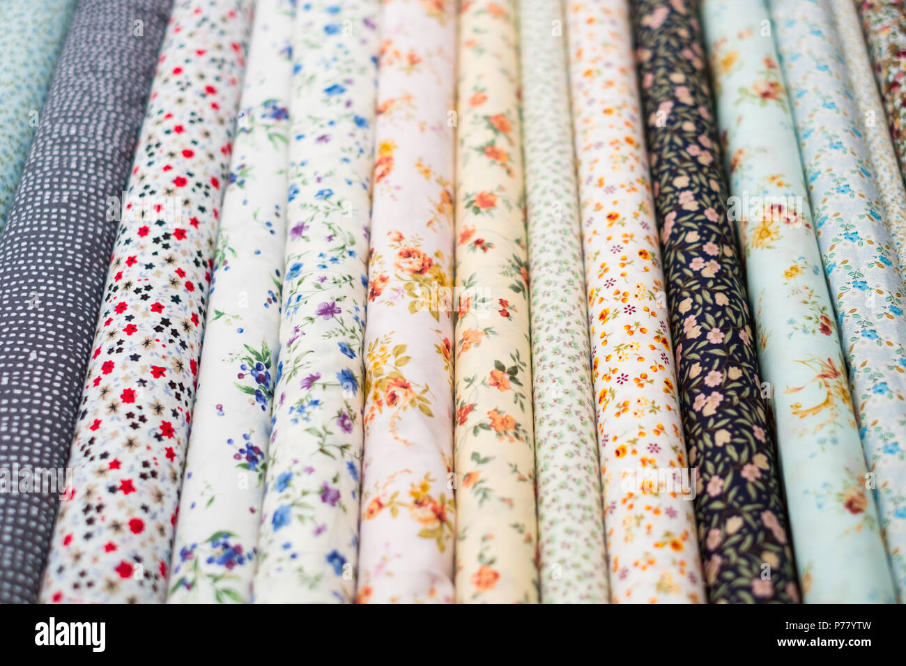 fabric rolls with floral pattern on textile market Stock Photo Alamy