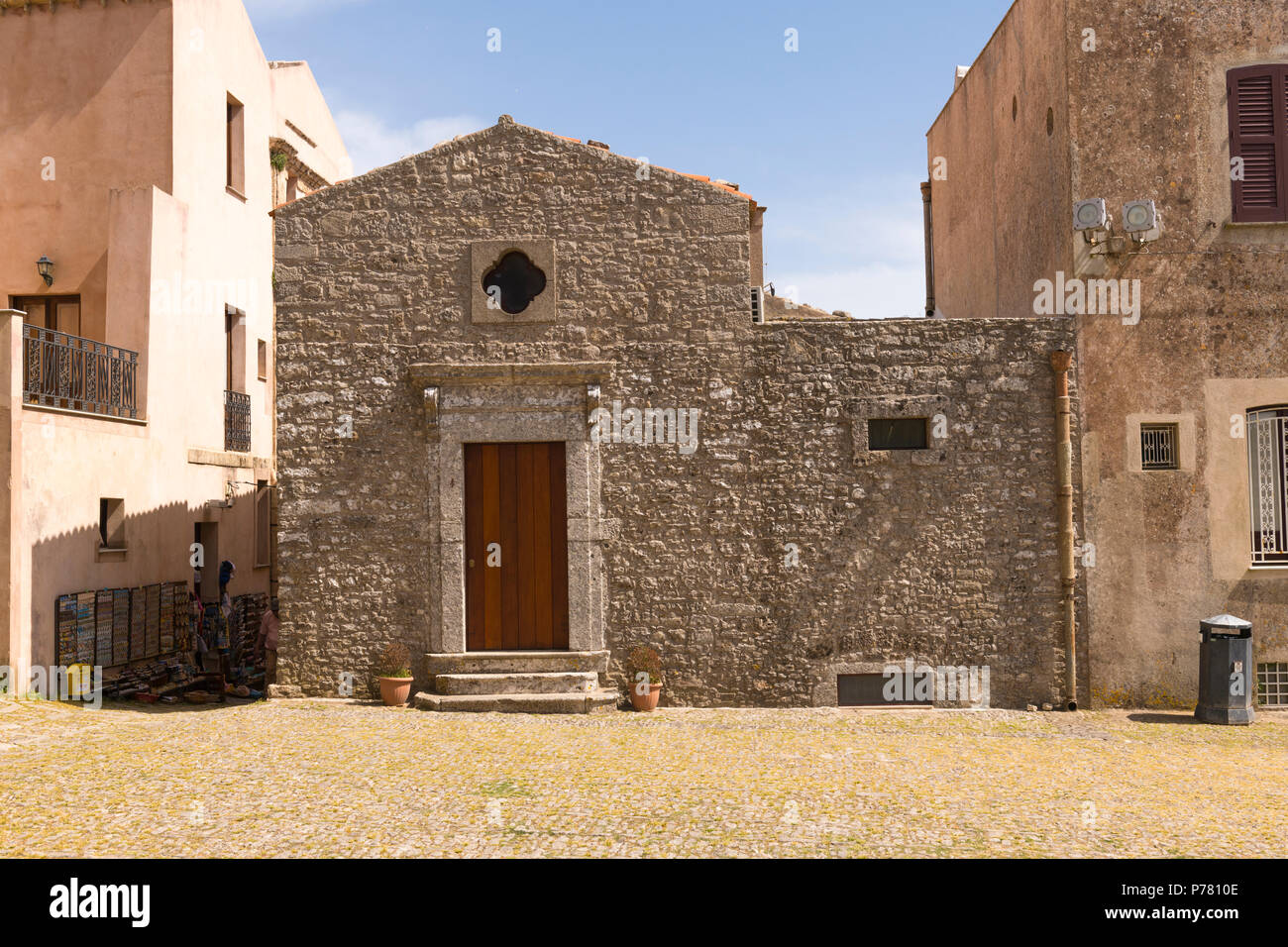 Italy Sicily medieval walled town Erice on Monte San Giuliana cult Venus Erycina street scene ancient stone building small windows wooden door steps Stock Photo