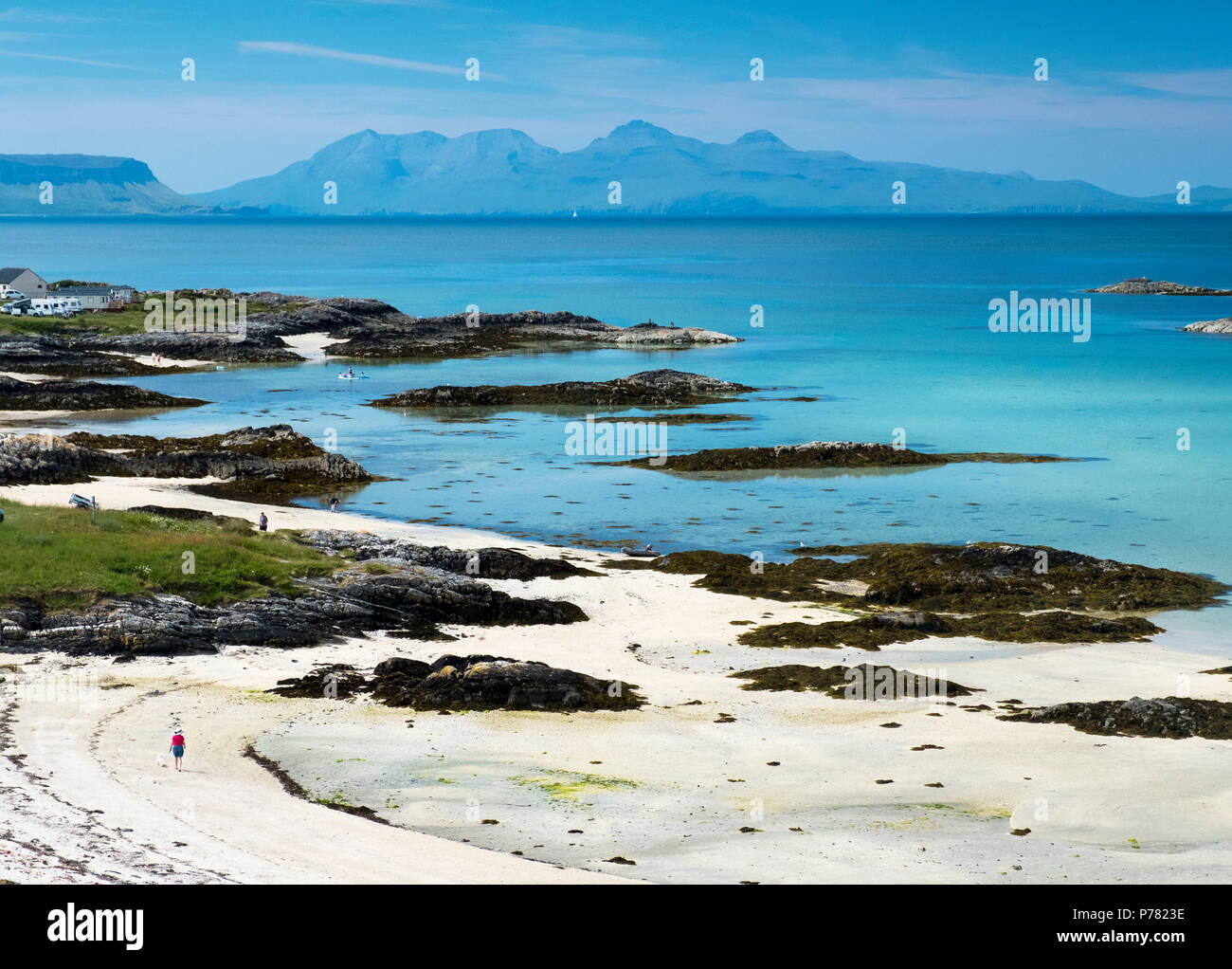 A sandy beach at Traigh near Arisaig with the islands of Eigg and Rum in the distance. Stock Photo