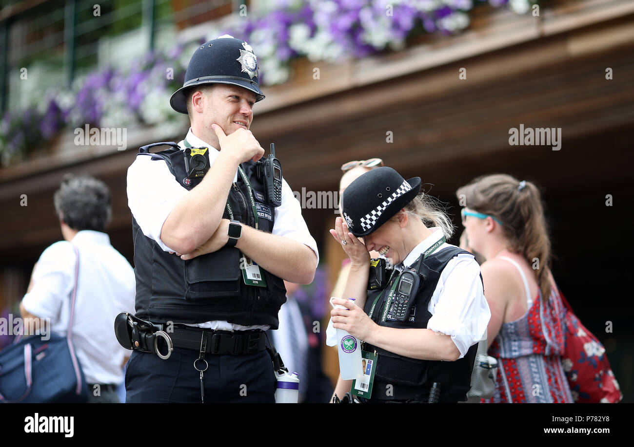 Police presence on day three of the Wimbledon Championships at the All England Lawn Tennis and Croquet Club, Wimbledon. Stock Photo