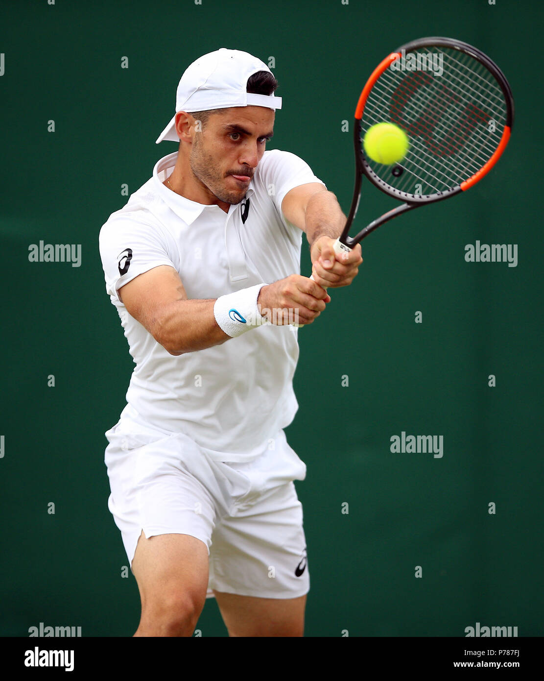 Thomas Fabbiano in action on day three of the Wimbledon Championships at  the All England Lawn Tennis and Croquet Club, Wimbledon Stock Photo - Alamy