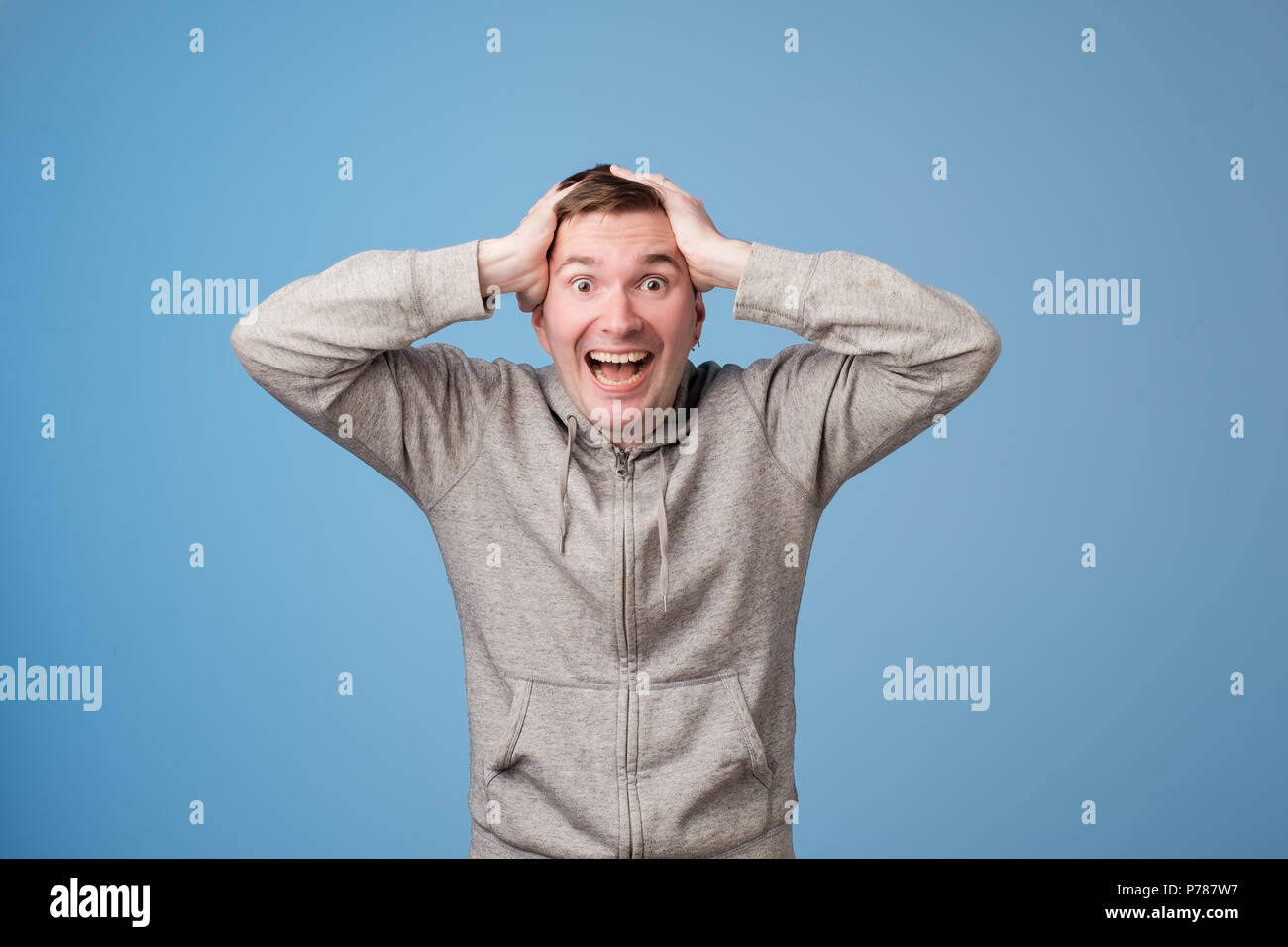 Portrait of young european man with shocked facial expression. He can not believe his luck or success. Stock Photo