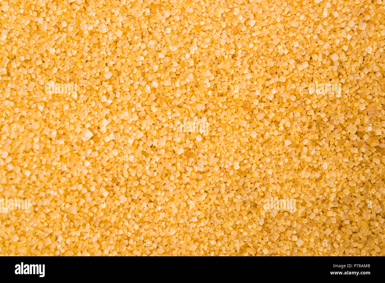 Brown sugar crystals background pattern top view Stock Photo