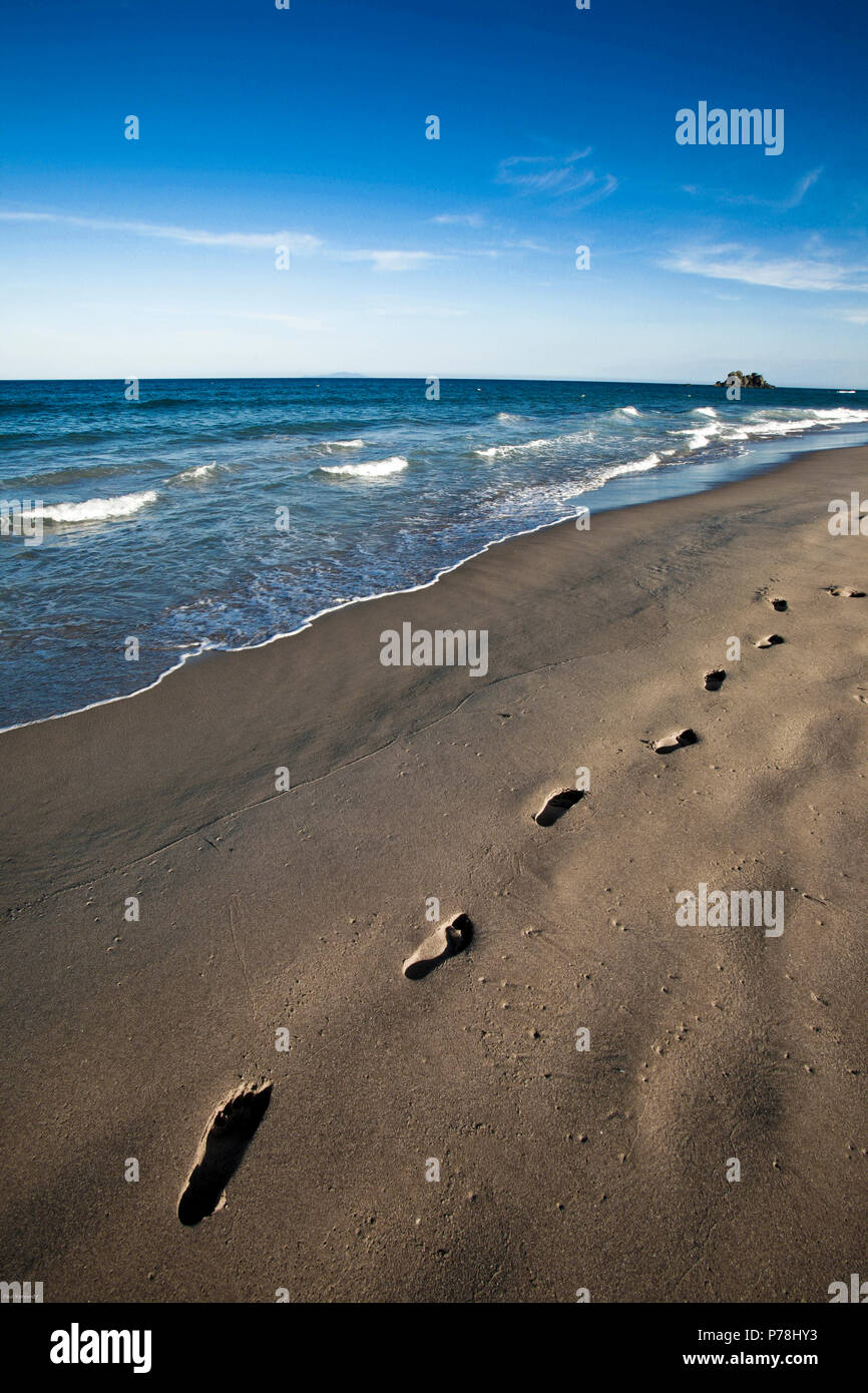 Footprints in sand at Whangamata beach, New Zealand Stock Photo