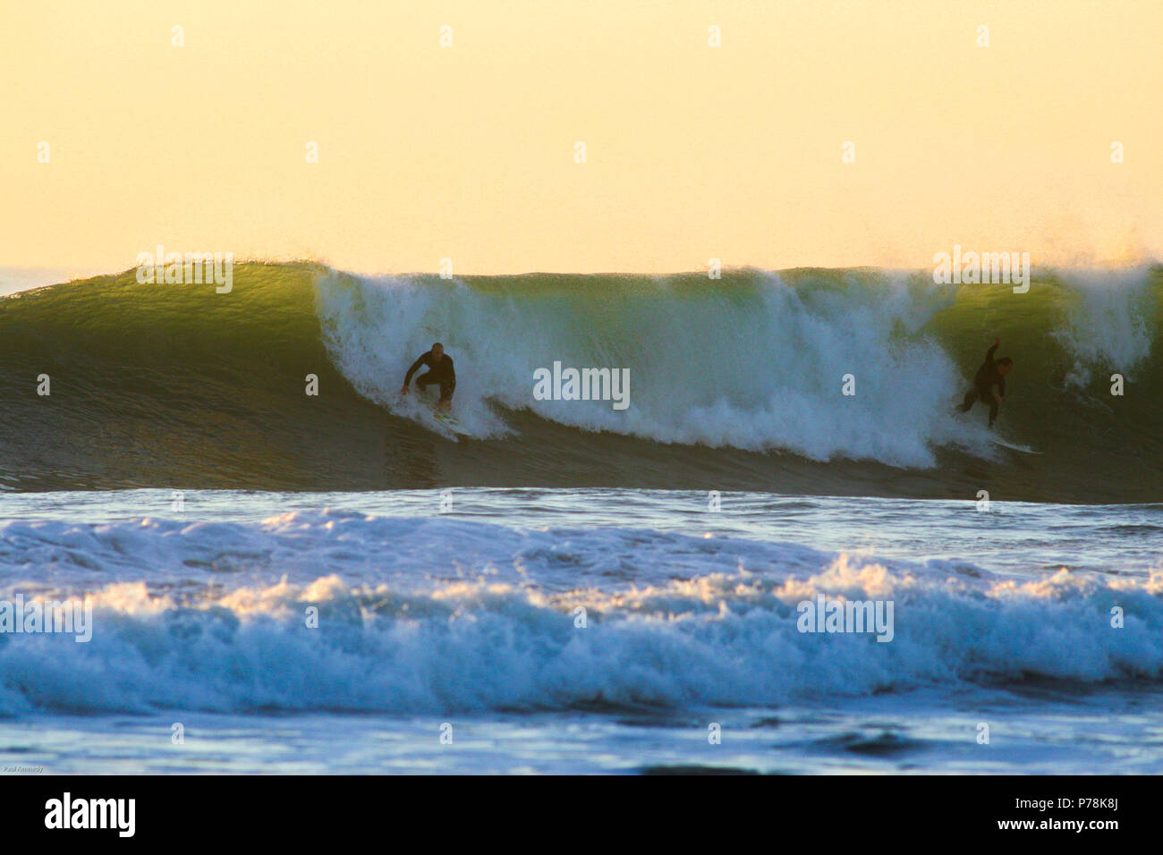 Surfing a reef wave in Taranaki, New Zealand Stock Photo