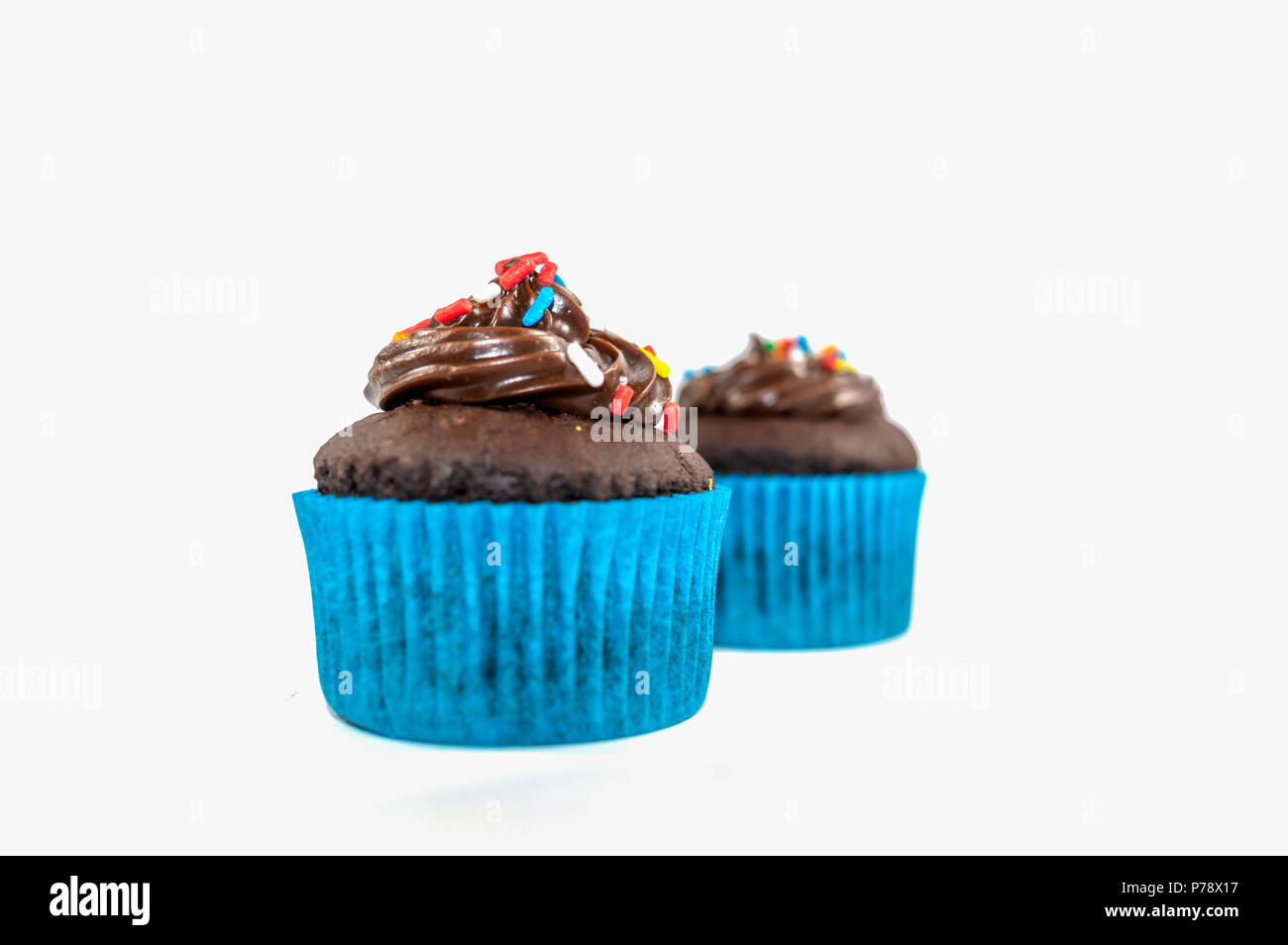 Two Chocolate cupcakes isolated on white background Stock Photo