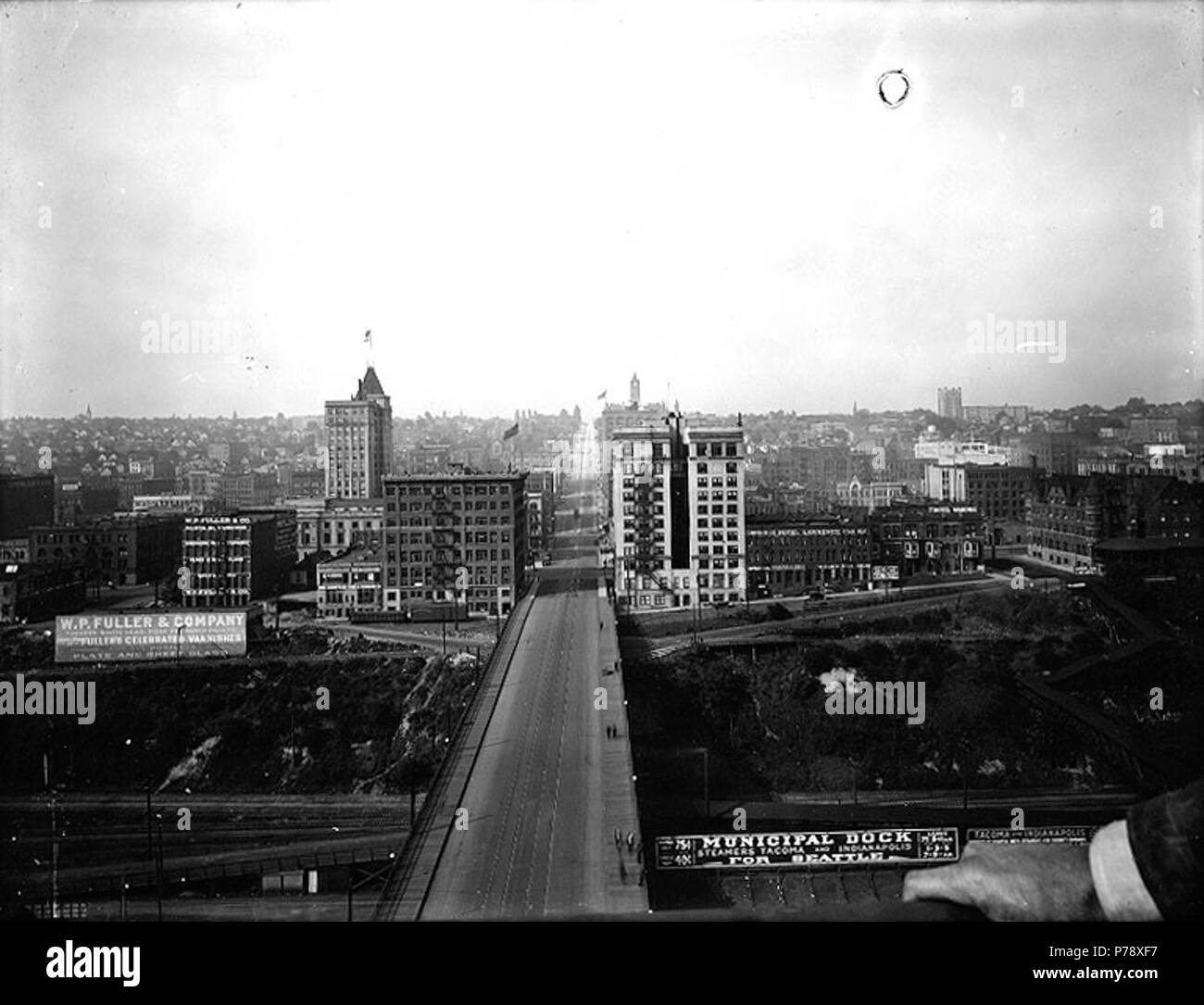 . English: Eleventh Street Bridge, Tacoma, Washington, ca. 1919. English: Looking west. On sleeve of negative: Tacoma. Looking up 11th St. from towers of the bridge. Subjects (LCTGM): Bridges--Washington (State)--Tacoma; Streets--Washington (State)--Tacoma Subjects (LCSH): Eleventh Street Bridge (Tacoma, Wash.); Eleventh Street (Tacoma, Wash.); Tacoma (Wash.)--Buildings, structures, etc.  . circa 1919 19 Eleventh Street Bridge, Tacoma, Washington, ca 1919 (BAR 106) Stock Photo