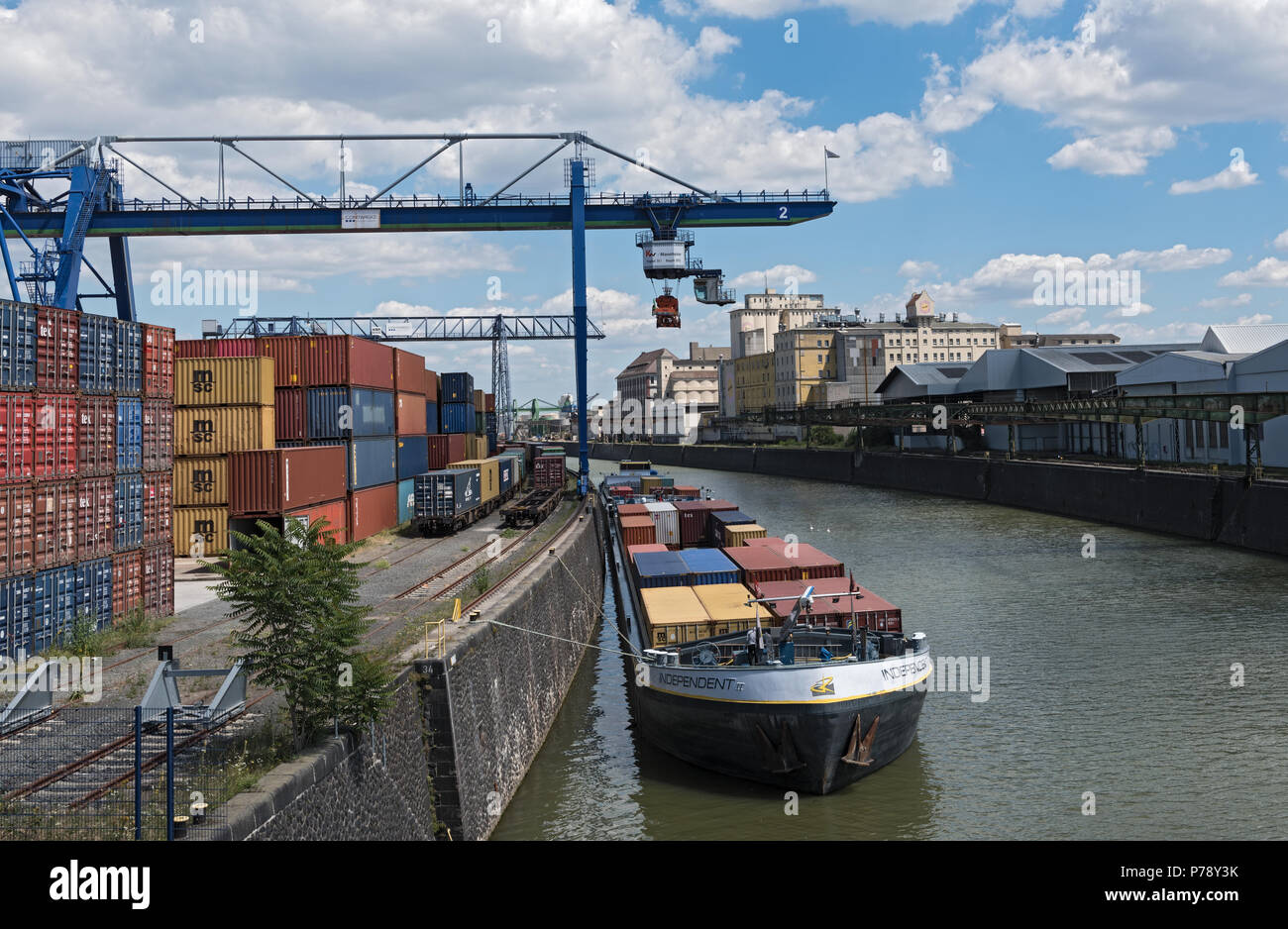 Container loading in a container handling crane in the east harbor, Frankfurt, Germany Stock Photo