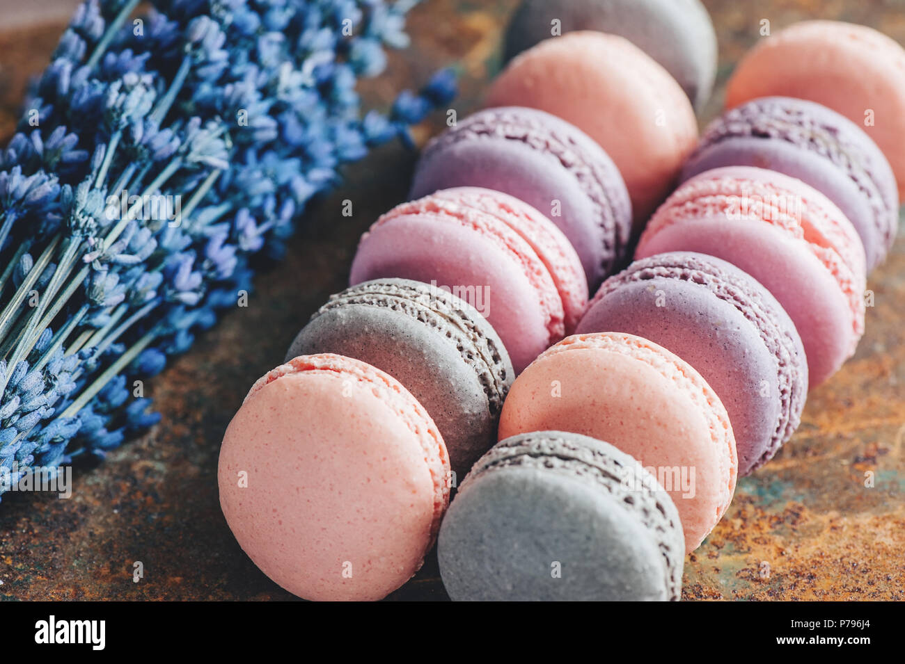 Freshly baked multi-colored macaroons close-up, selective focus. Stock Photo