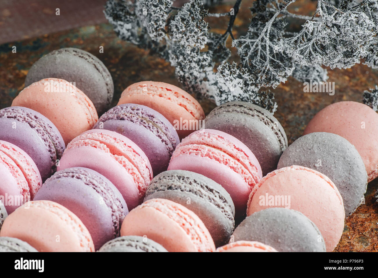 Freshly baked multi-colored macaroons close-up, selective focus. Stock Photo