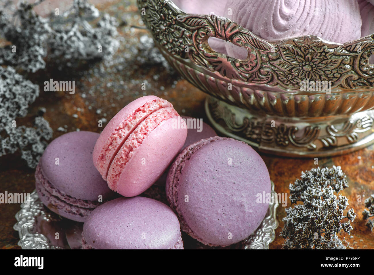 Freshly baked multi-colored macaroons close-up, selective focus. Stock Photo