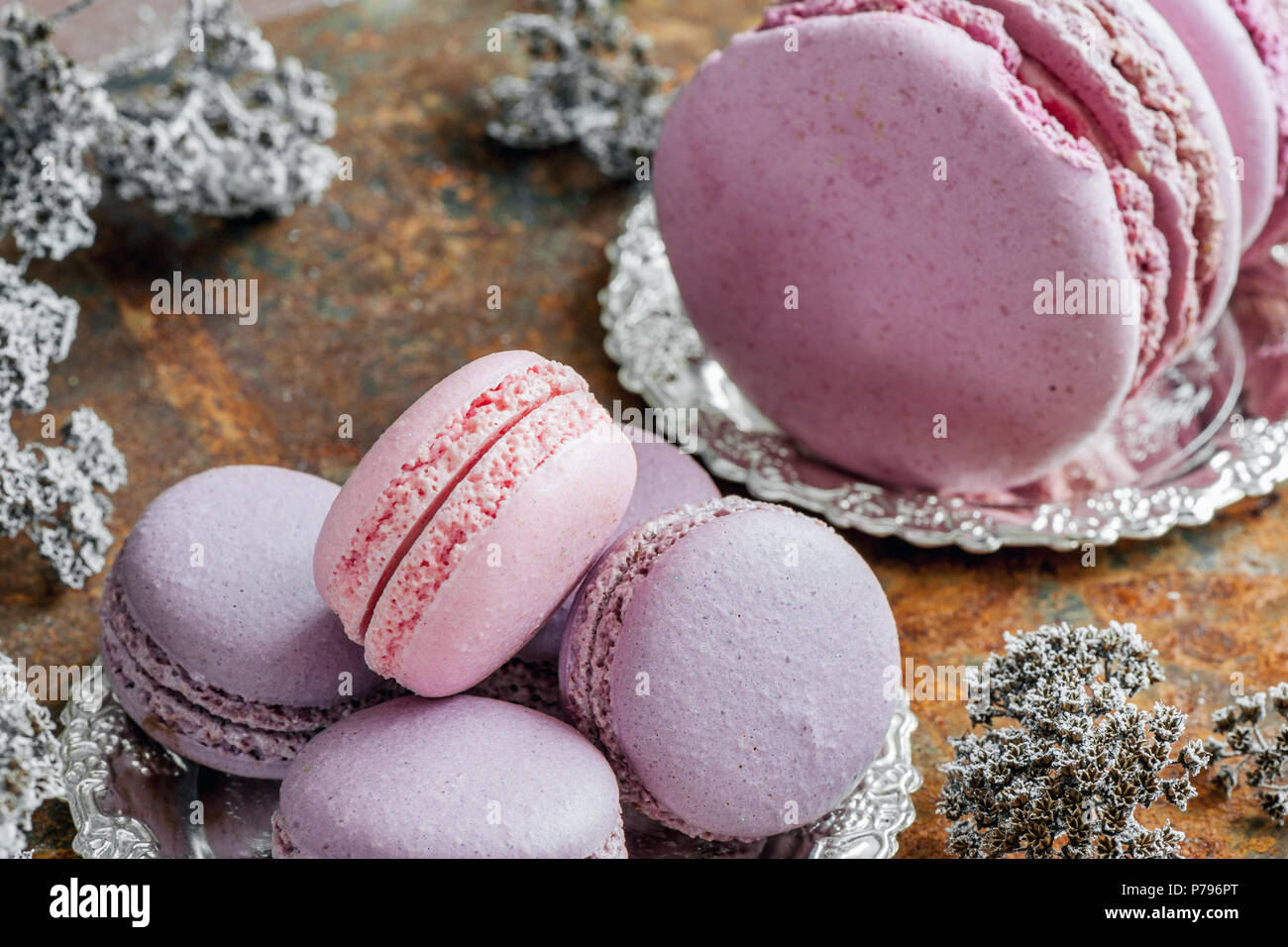 Freshly baked multi-colored macaroons close-up, selective focus. Stock Photo