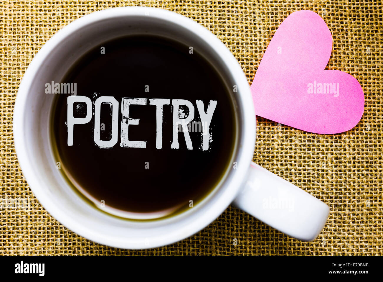 Text sign showing Poetry. Conceptual photo Literary work Expression of feelings ideas with rhythm Poems writing Tea time coffee cup office typing work Stock Photo