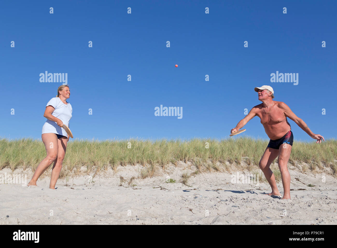 couple playing beach ball, beach, Wustrow, Fischland, Mecklenburg-West Pomerania, Germany Stock Photo