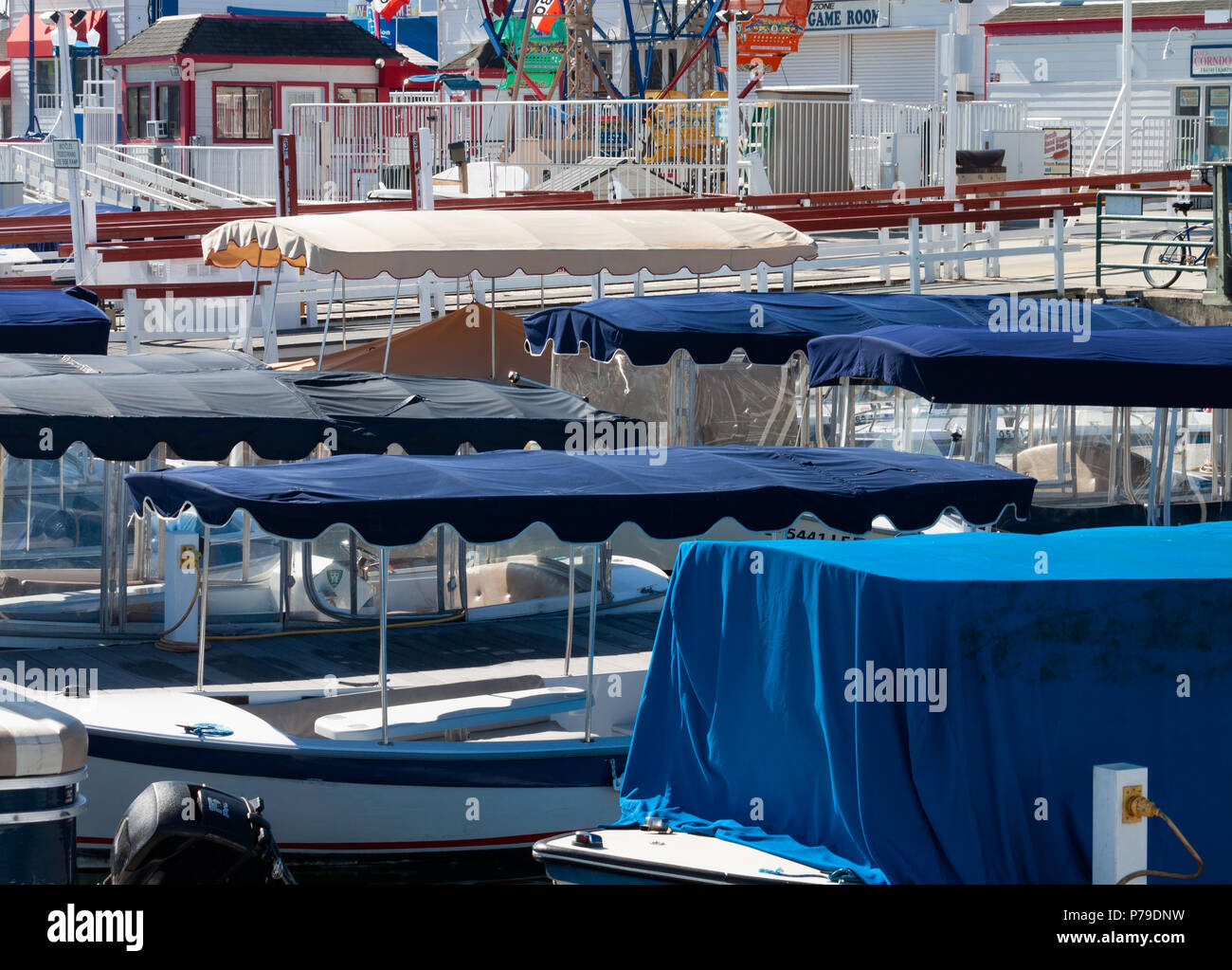 electric boat canopies at the Balboa fun zone in Newport Beach California on a sunny day Stock Photo