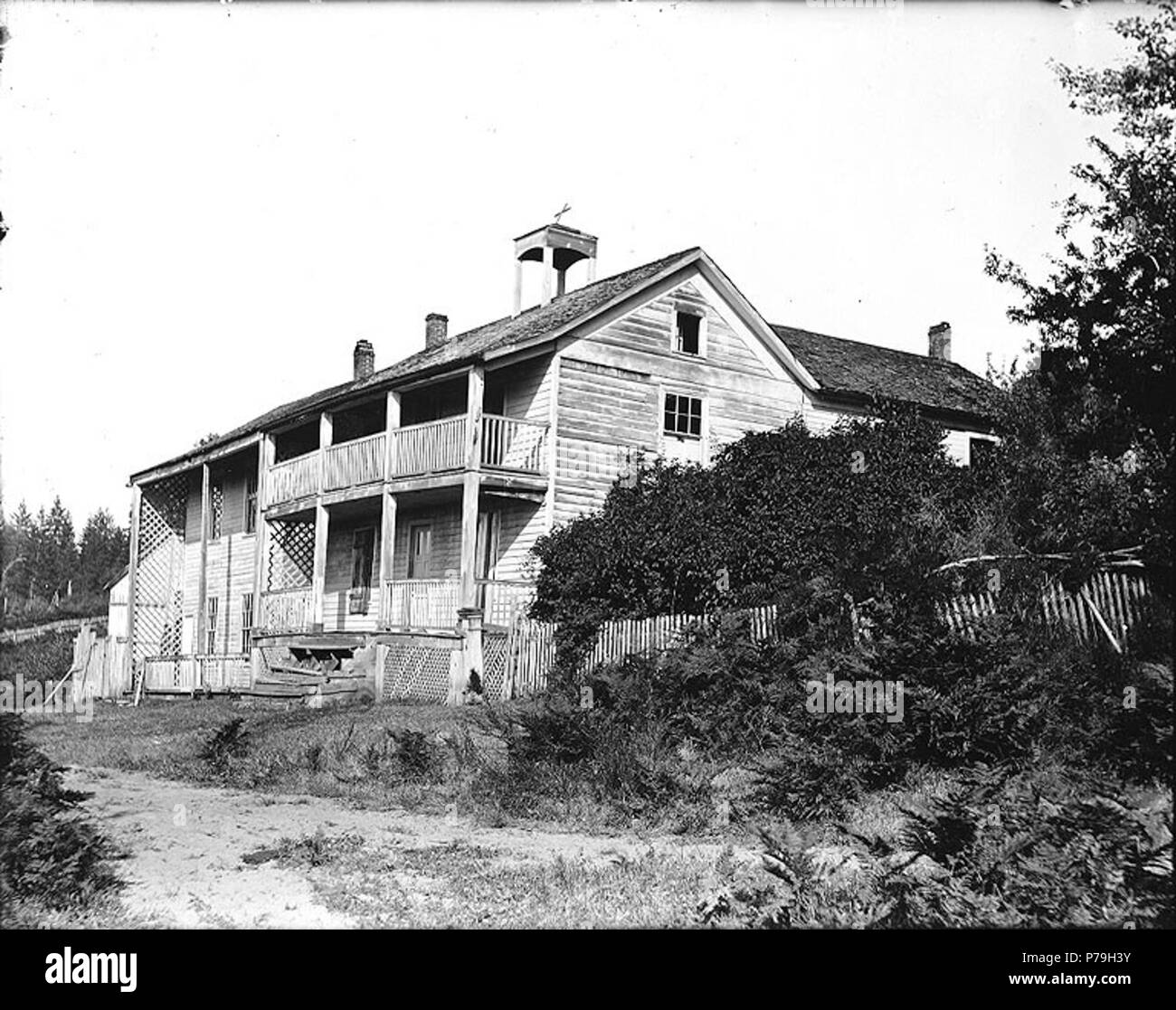 . English: Former site of the Providence School for Young Ladies, Steilacoom, Washington, ca. 1907. English: Located next to the Immaculate Conception Mission, the school was operated by the Sisters of Charity from 1864 to 1875. Subjects (LCTGM): Private schools--Washington (State)--Steilacoom Subjects (LCSH): Providence School for Young Ladies (Steilacoom, Wash.); Girls' schools--Washington (State)--Steilacoom; Steilacoom (Wash.)--Buildings, structures, etc.  . circa 1907 20 Former site of the Providence School for Young Ladies, Steilacoom, Washington, ca 1907 (BAR 185) Stock Photo