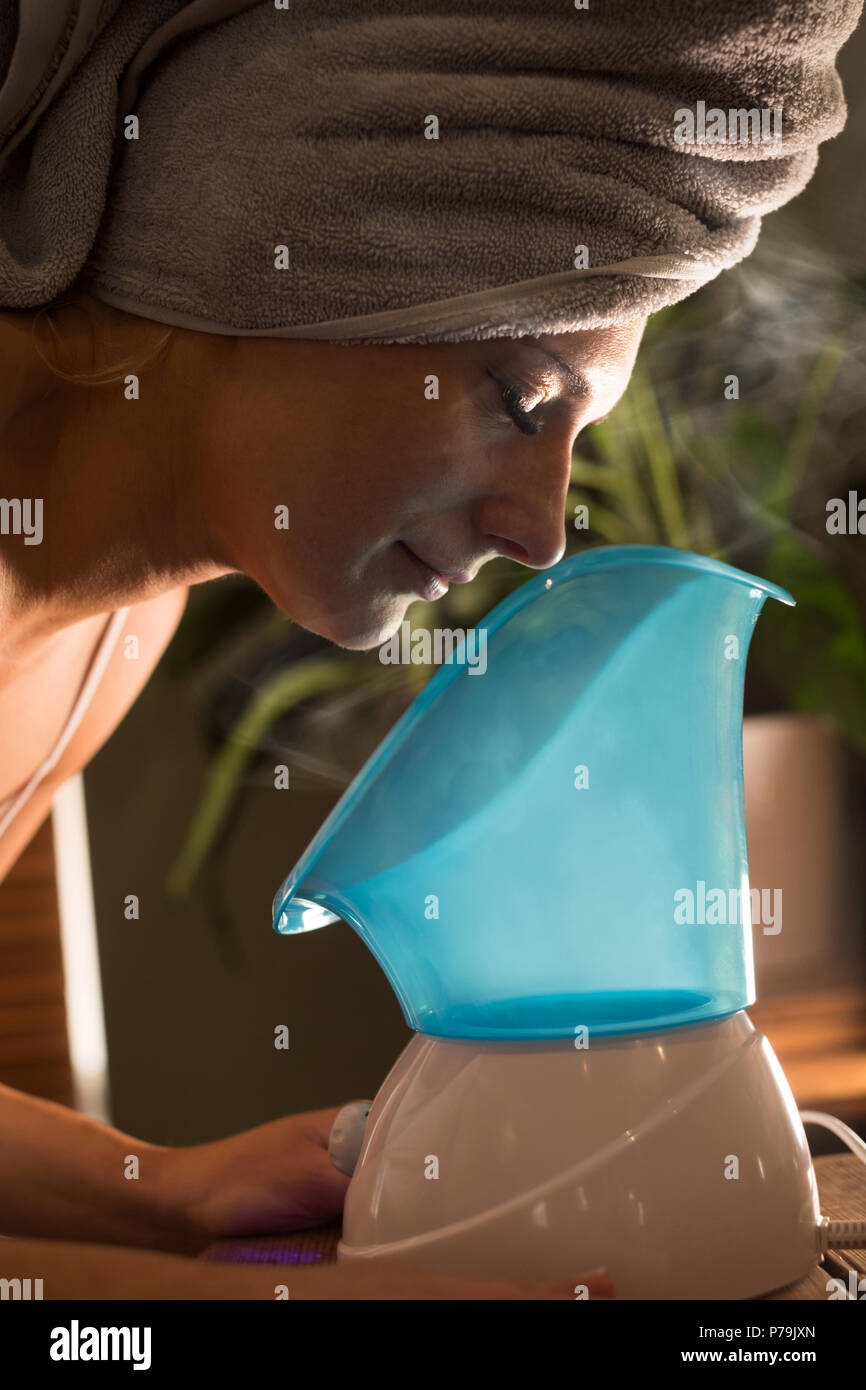 Pregnant woman using spa steam inhaler Stock Photo Alamy