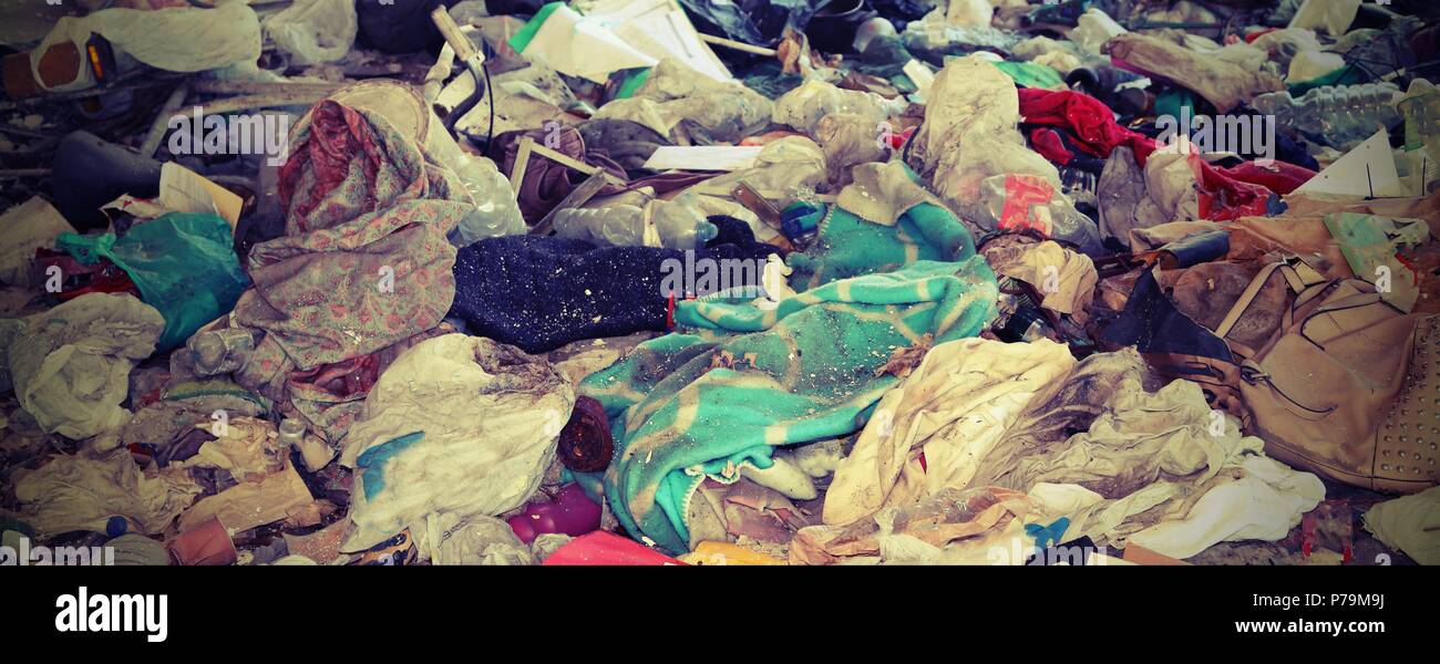 messy pile of old broken rags located on a street Stock Photo - Alamy