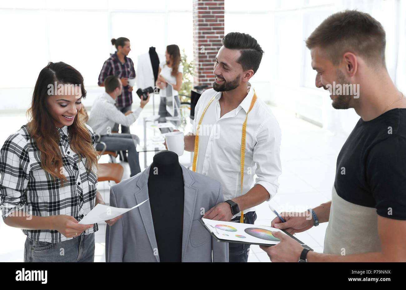 Fashion designer discuss color hi-res stock photography and images - Alamy