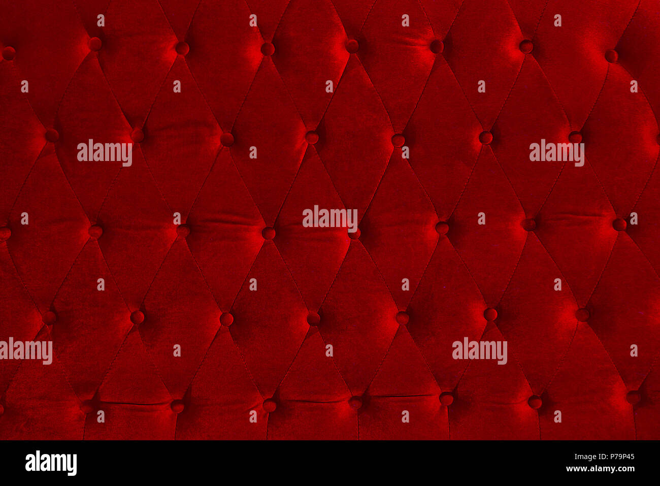 the beautiful holiday horizontal  background,  of red upholstery fabric  with sparklets Stock Photo