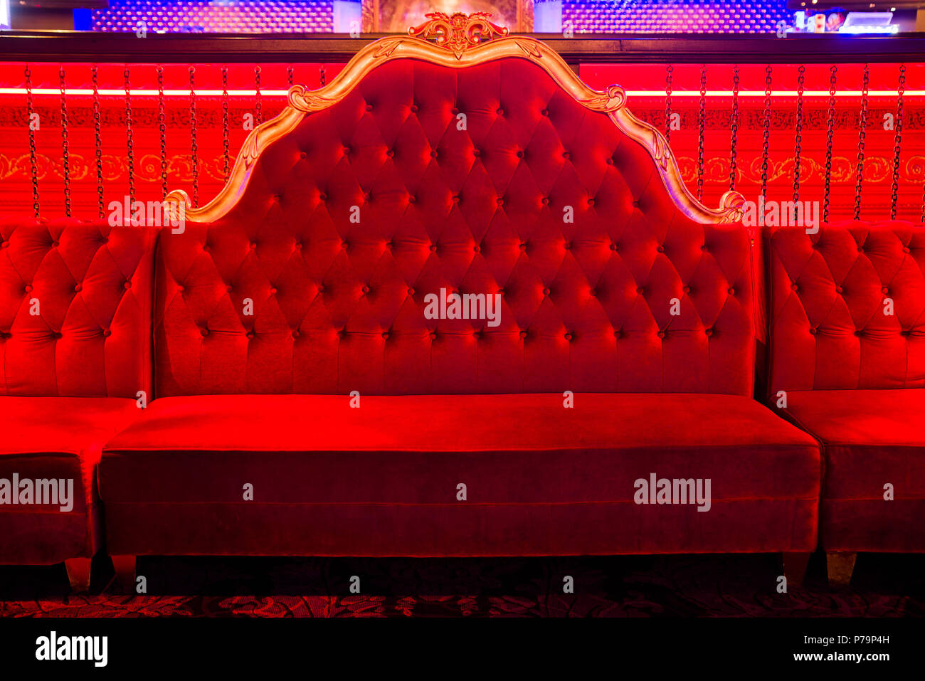 big, long, red  soft chair  -   throne,  horizontal photo Stock Photo