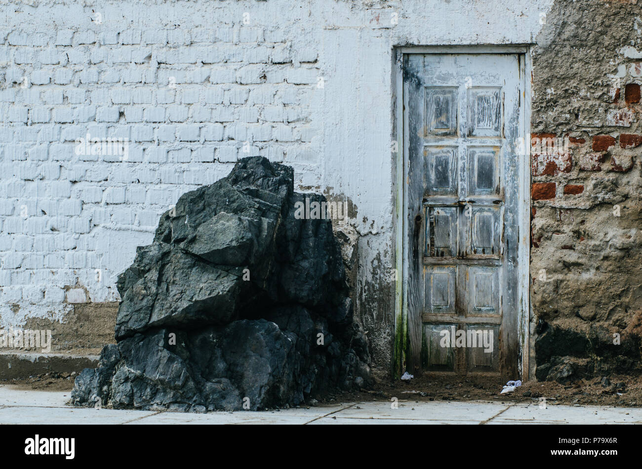 Old Door Of A House On The Edge Of The White Beach With A Large