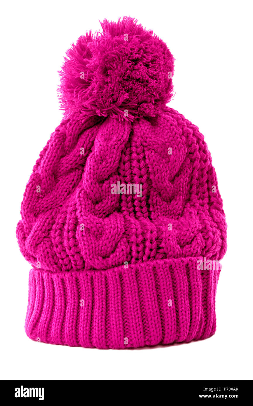 Pink bobble hat or knit hat isolated against a white background. Stock Photo