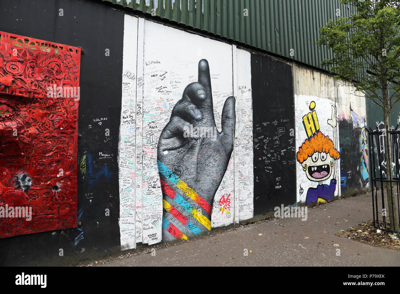 Political grafitti covers the Peace Wall in Belfast, Northern Ireland