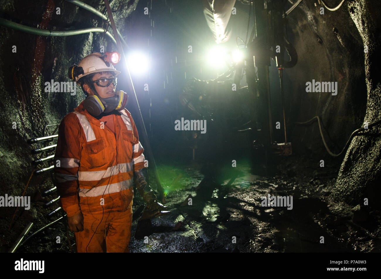 Cerro de Pasco, Peru - July 14th 2017: Miner in the mine. Miner inside the mine well uniformed with a look of confidence. Stock Photo