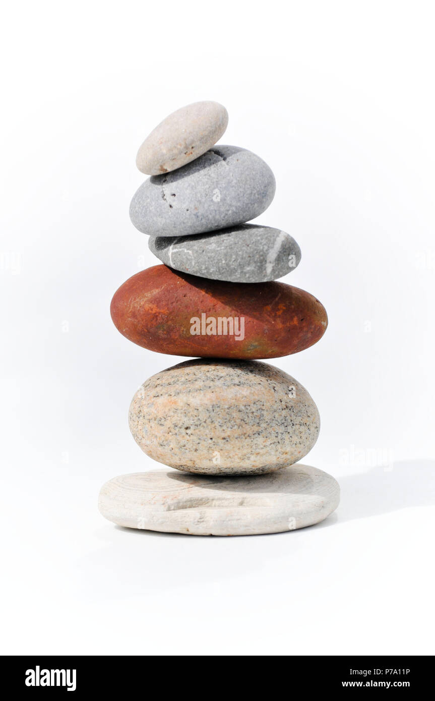 Six stones balancing on each other to create a tower of stones. Image ...