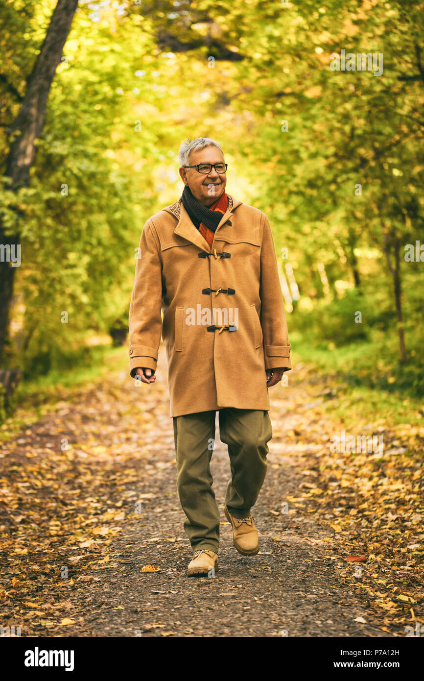Man walking away coat hi-res stock photography and images - Alamy