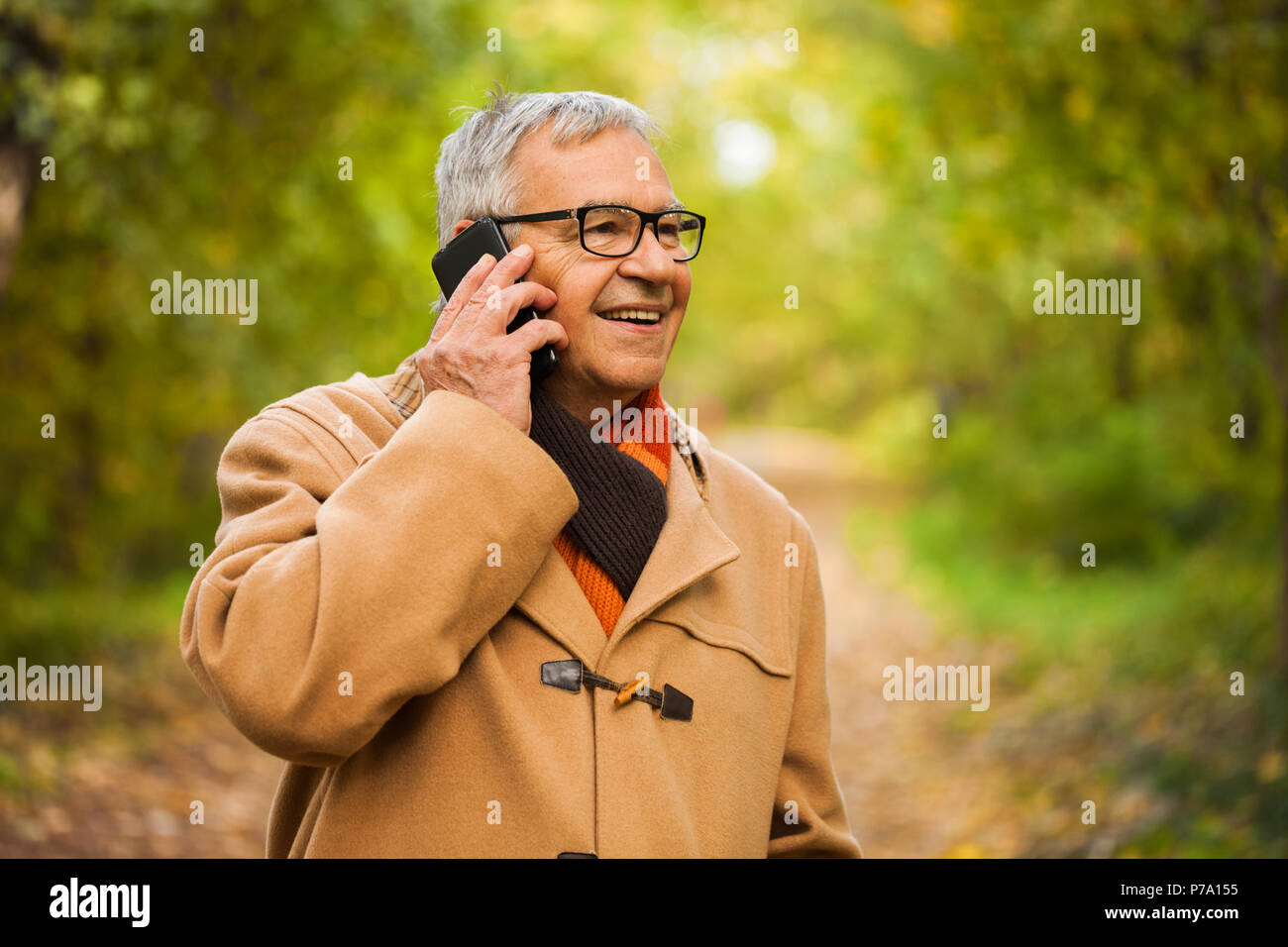 Elderly man walking phone hi-res stock photography and images - Alamy