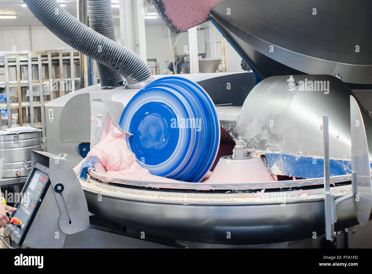 Cutter for grinding meat. Sausage production line. Process of sausage