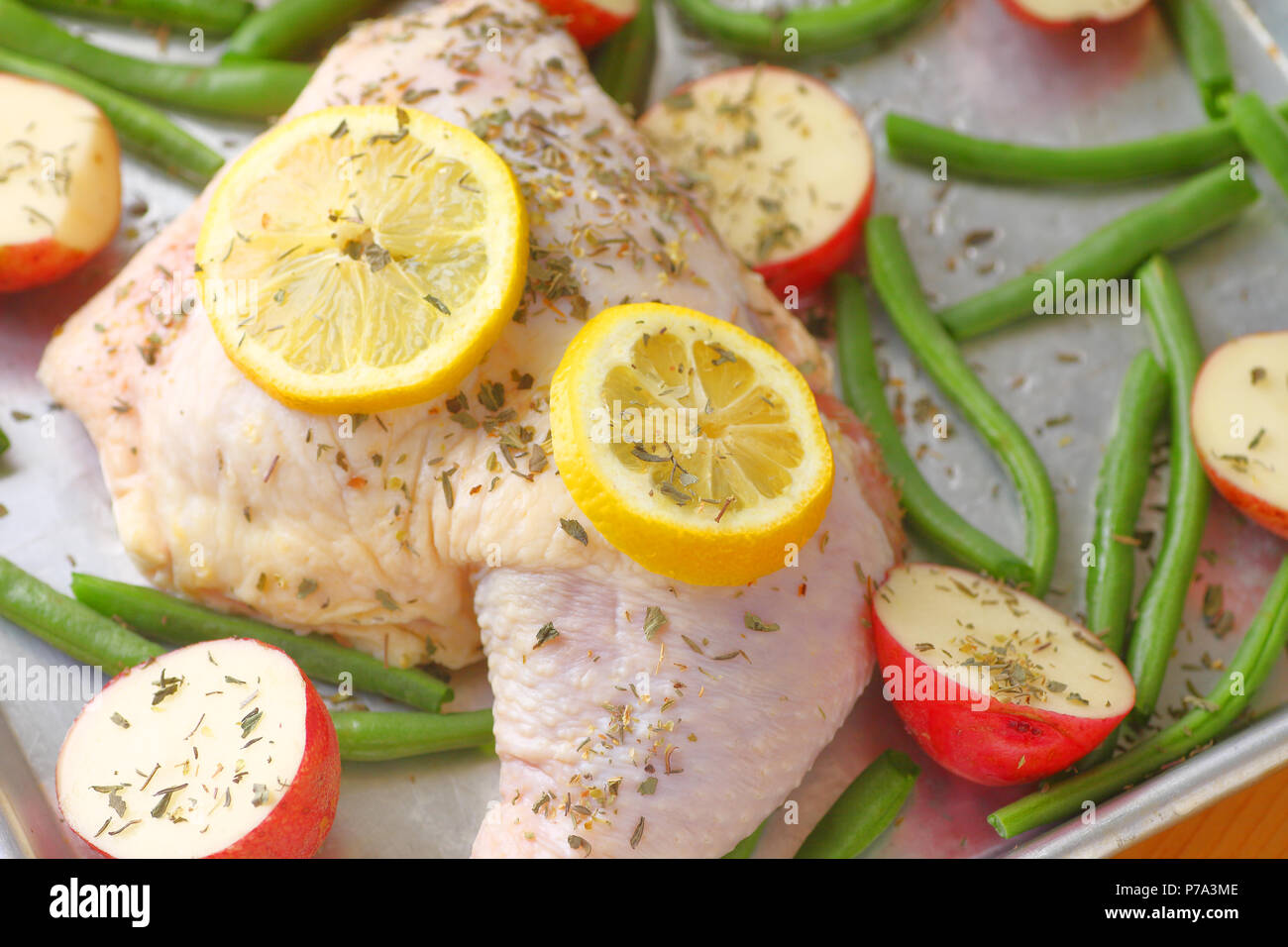 Chicken dinner seasoned and ready to bake Stock Photo