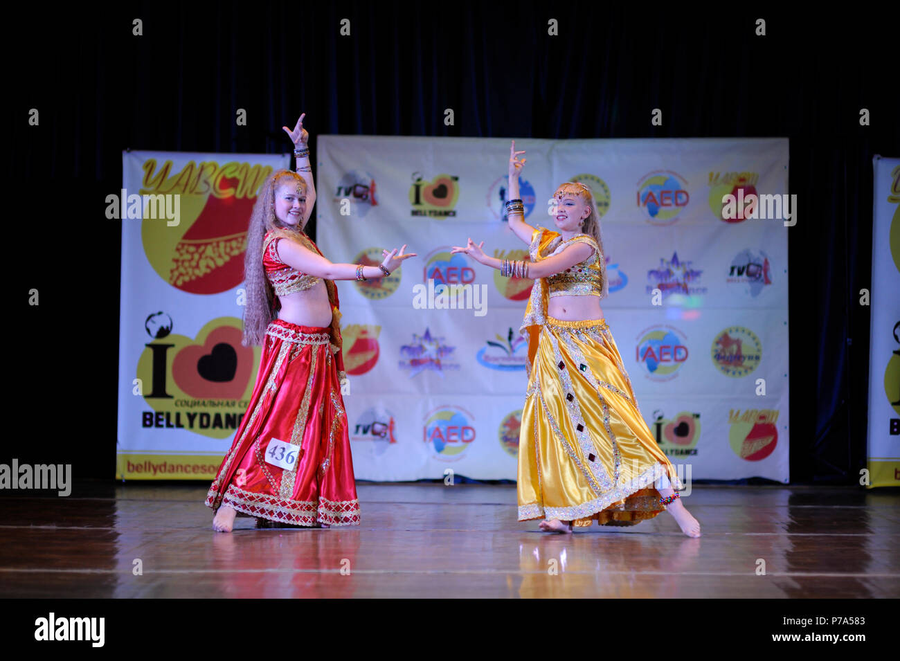 Dancers in a native dresses performing oriental dance on stage. Festival Miss Belly dance 2017. March 7, 2017. Kiev, Ukraine Stock Photo