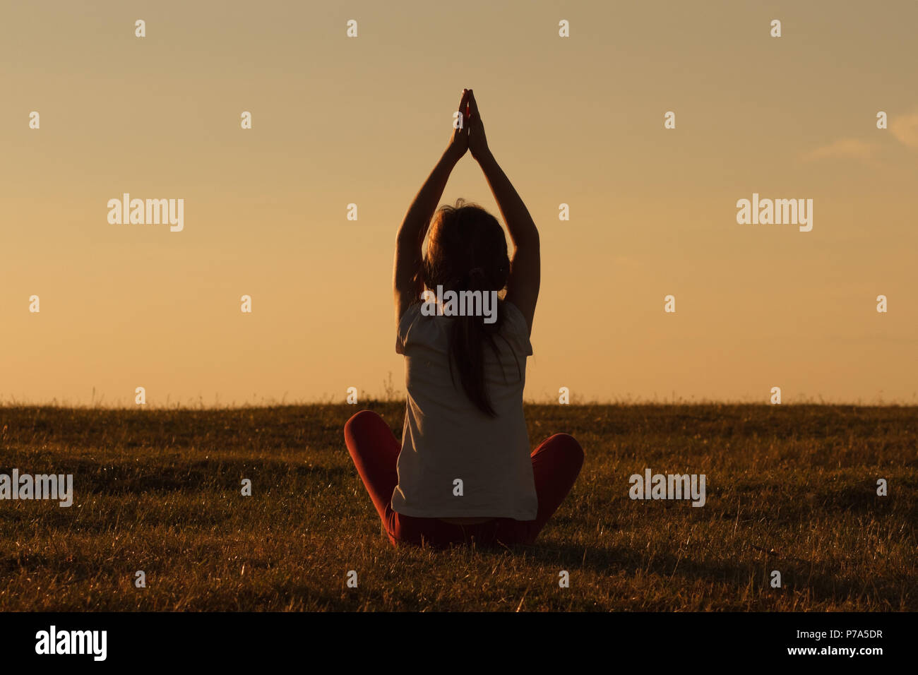 Little girl doing yoga Stock Photo - Alamy