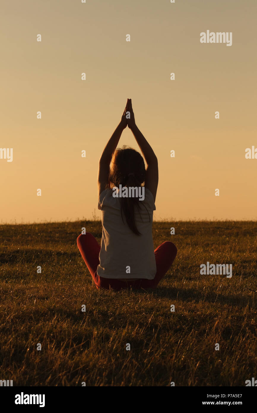 Little girl doing yoga Stock Photo - Alamy